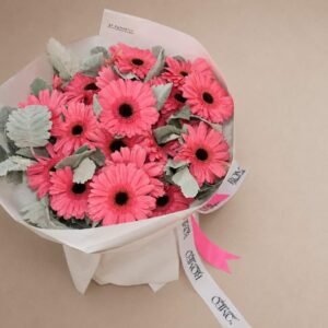 Pink gerberas bouquet with dusty miller foliage by Romeo Flower Boutique