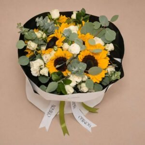 Sunflowers white roses and eucalyptus bouquet in dark wrap top view Romeo design