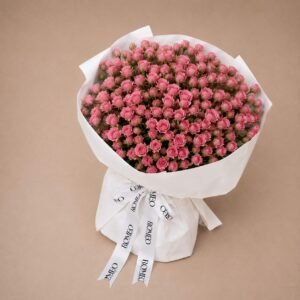Pink mini spray roses bouquet in white wrap on beige, Romeo Flower Boutique Be Romantic